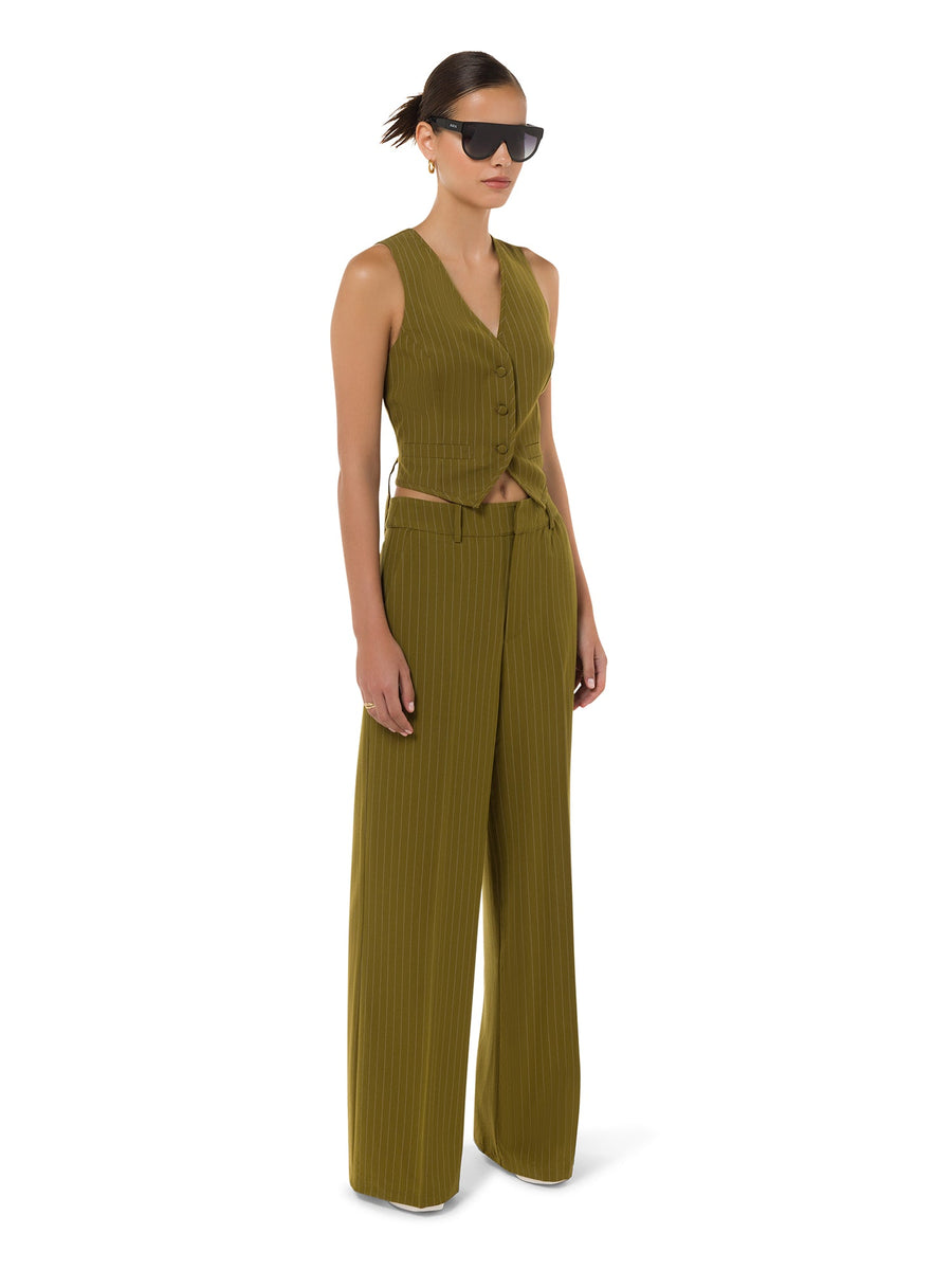 Side view of Verde Linea tailored flare trousers in moss green – ALALYA
